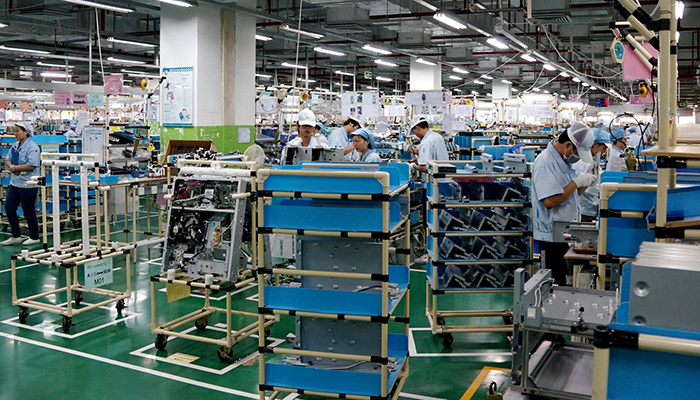 Electronics assembly line with workers in a Chinese factory